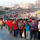 Migrant workers walk towards a bus station on the outskirts of Delhi.